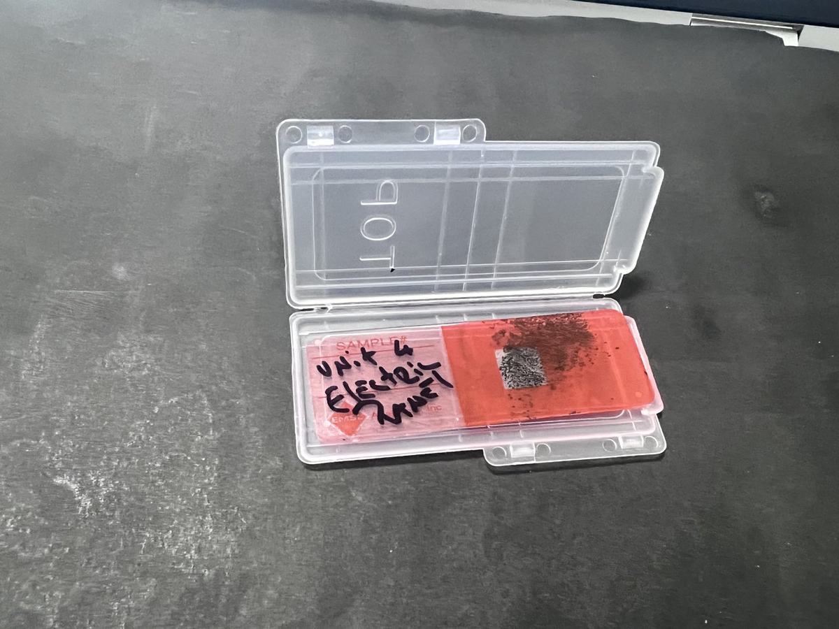 Labeled tape-lift sample in its case